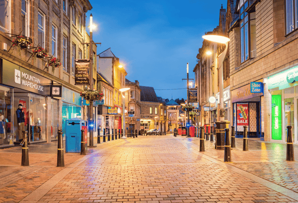 Storefront graphics show clearly in a high street in the UK. This is an effective way of marketing a business. 