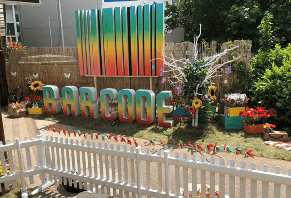 A brightly coloured event graphic shows festival goers clearly the name of the festival in a creative 3D way.
