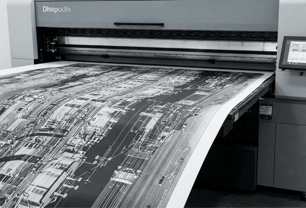 Large format white ink print coming out of printer 