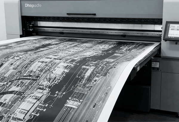 Large format white ink print coming out of printer