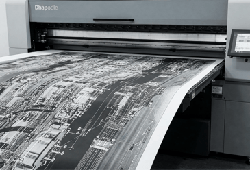 Large format white ink print coming out of printer