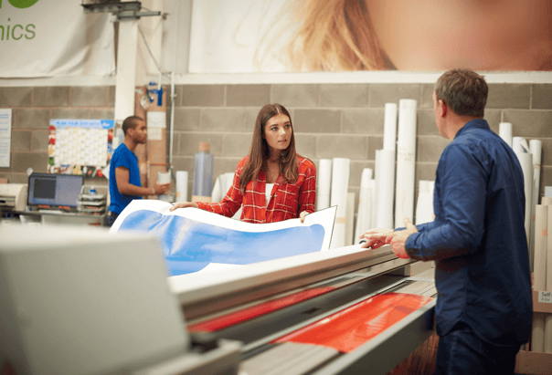 Two people deciding on their personal print design 