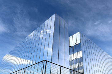 A mirrored building representing mirrored commercial interior design