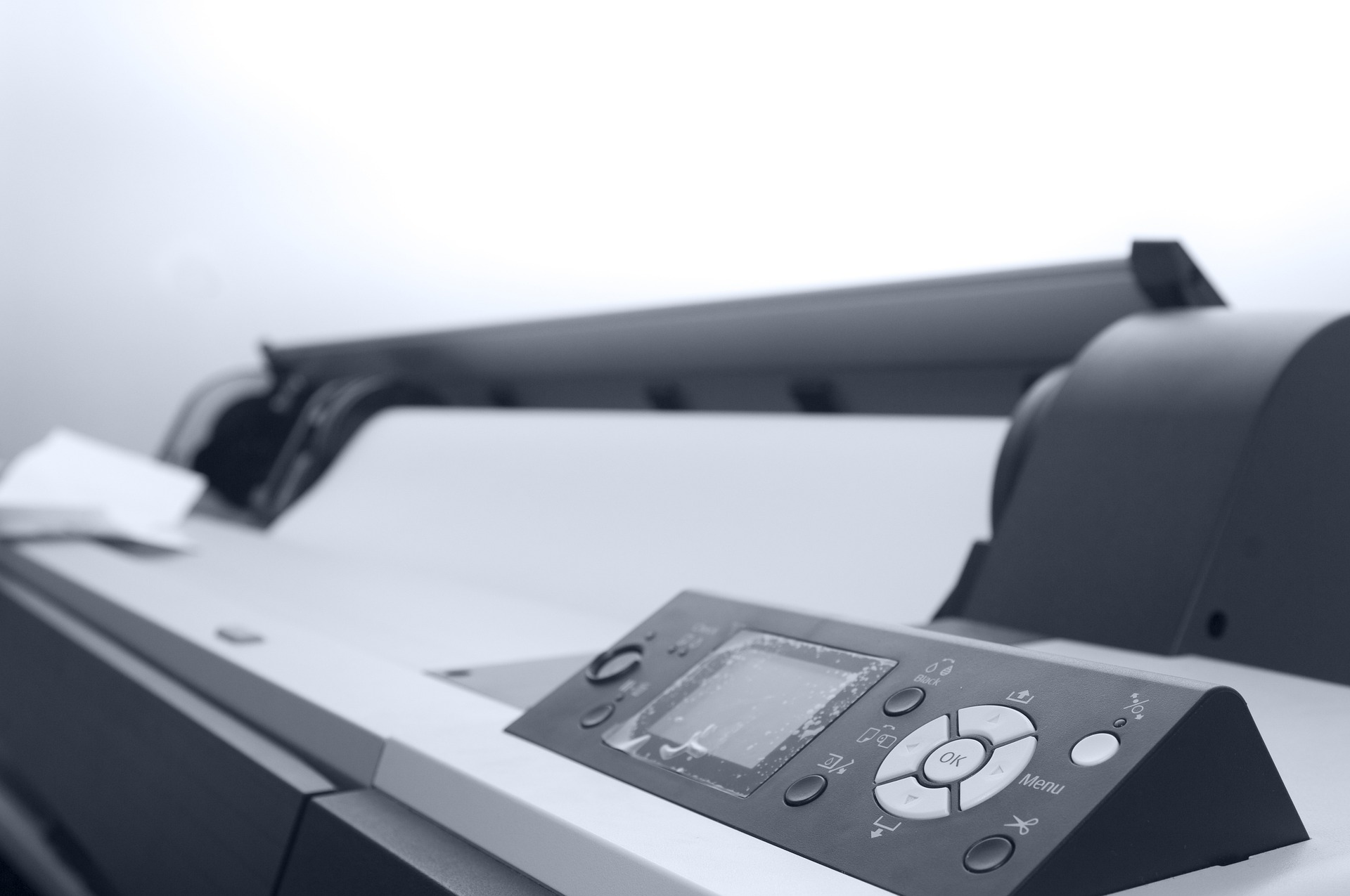 A black and white image of a large format printer