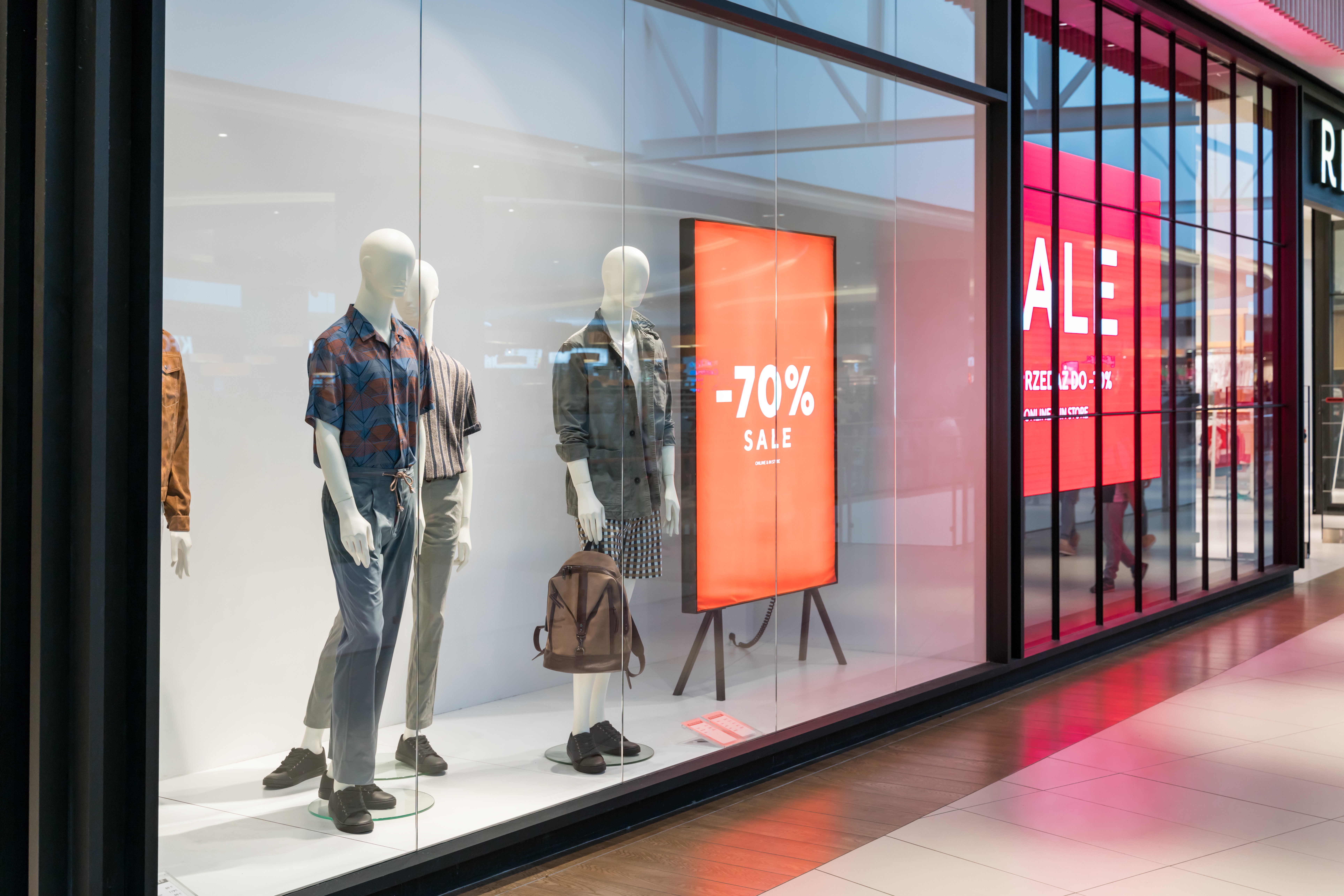 Vibrant retail storefront graphics and signage, showcasing digital print media strategies to attract shoppers and increase footfall.